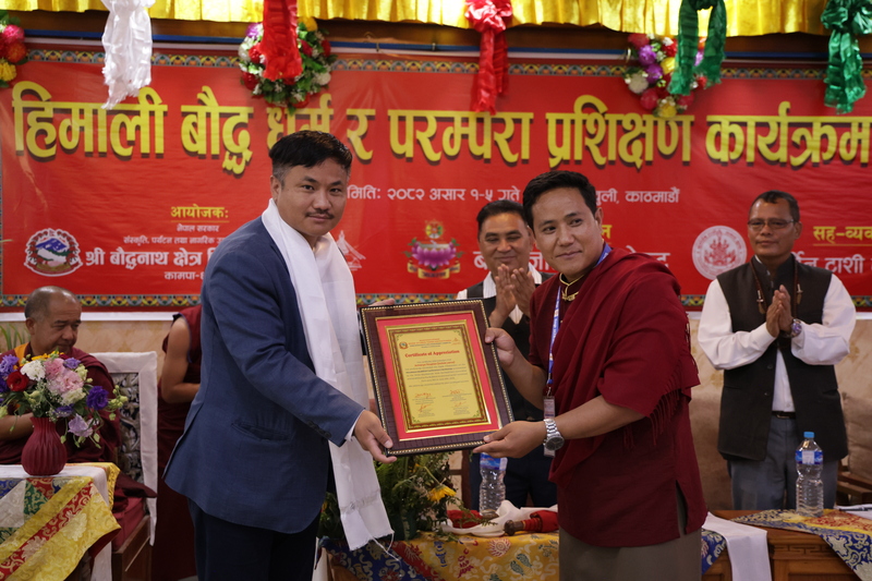 Slider Image: Distributing certificates to participants in a 5-day training on Himalayan Buddhism and traditions organized by the Shree Boudhanath Area Development Committee	