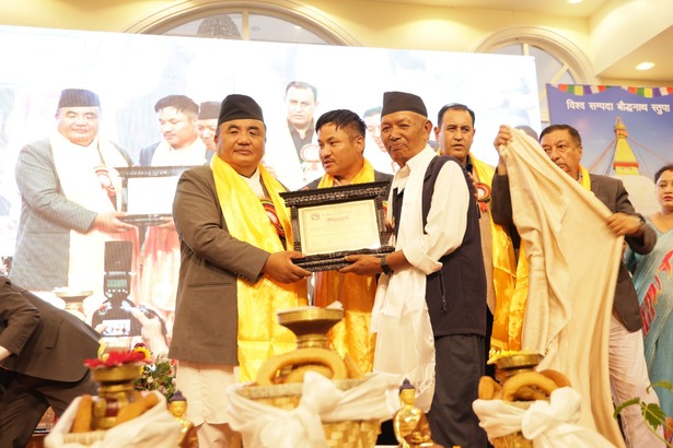 Slider Image: Boudhanath Area Development Committee employee Tashi Kumar Lama received the 'Outstanding Employee' honor at its 29th anniversary.	
